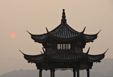 pavilion at sunset of west lake of hangzhou, china